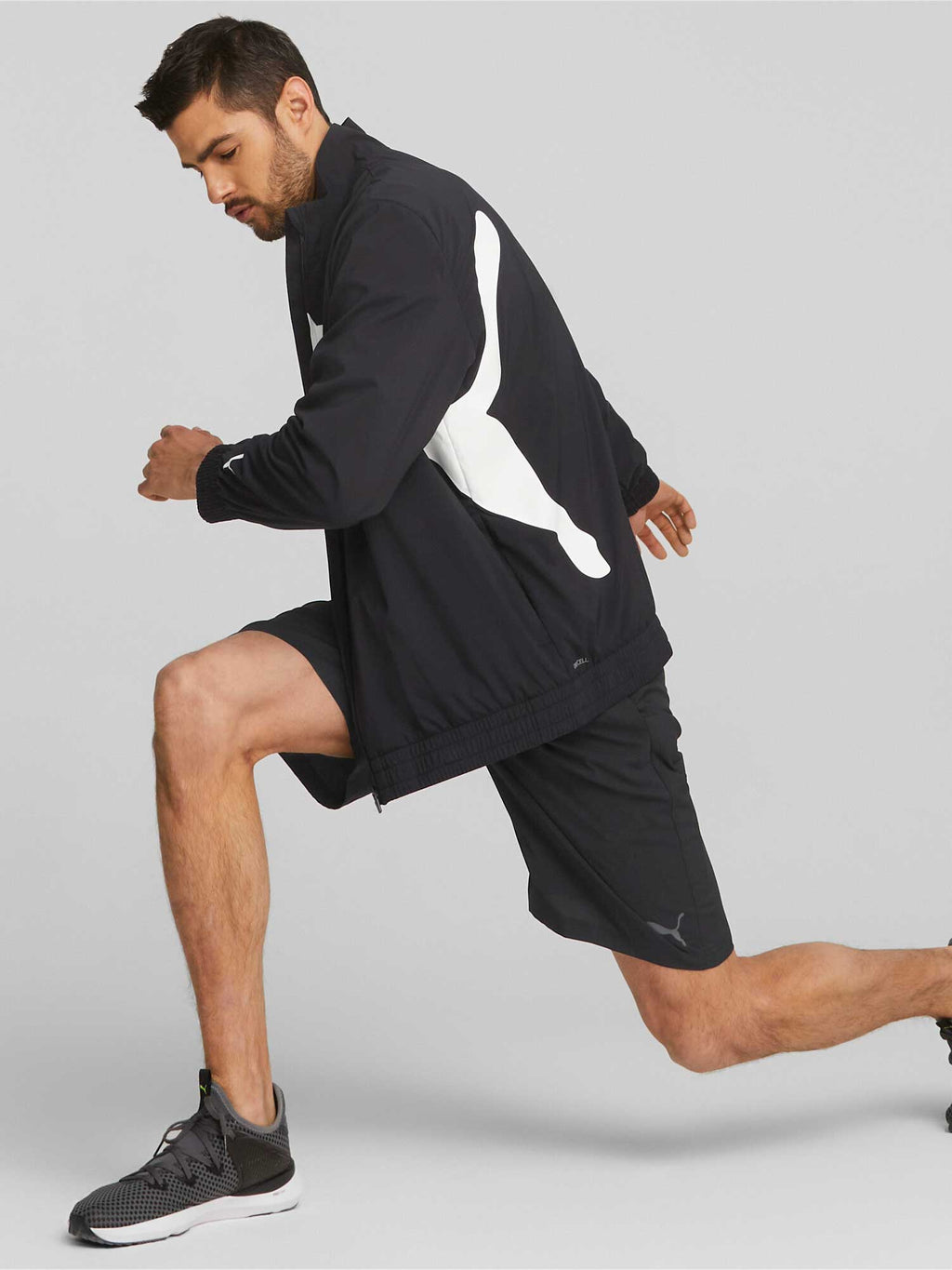 PUMA Спортно горнище TRAIN BIG CAT LINED WOVEN